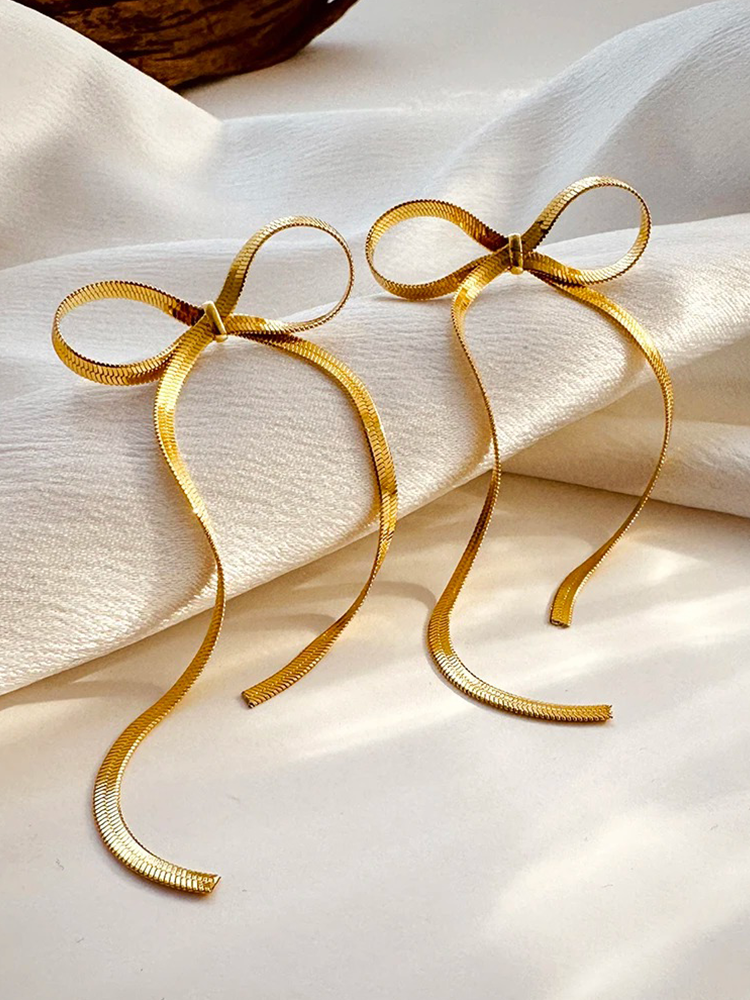 Cate – Pendientes Largos Nudo Cadena Serpiente Dorados