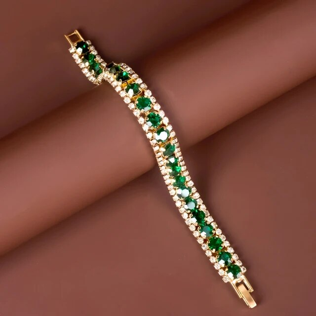 Maud – Pulsera Elegante Dorada con Accentos Verdes