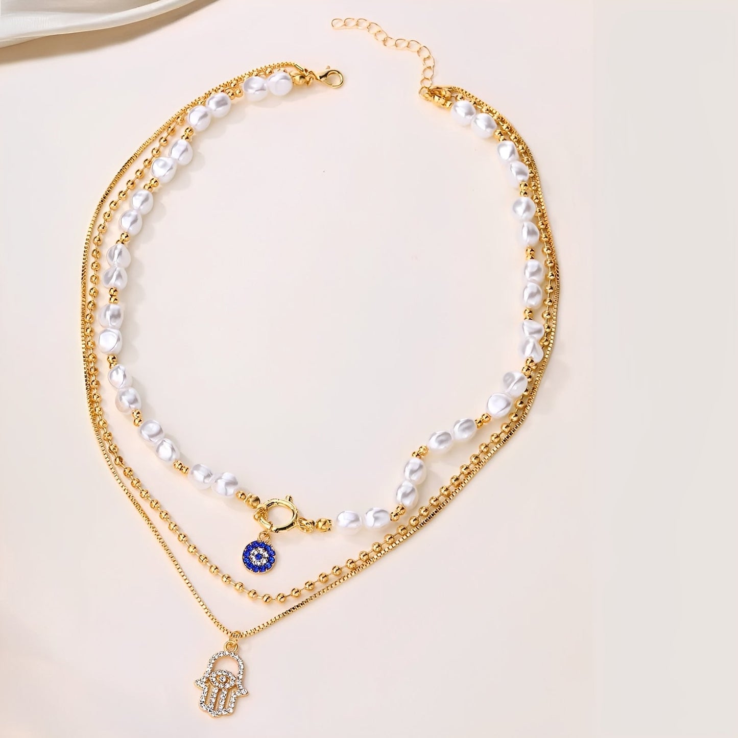 Nadia – Collar Multi-Rangos Perlas & Mano de Fatma