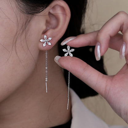 Pendientes de hilo para damas con motivo de flor