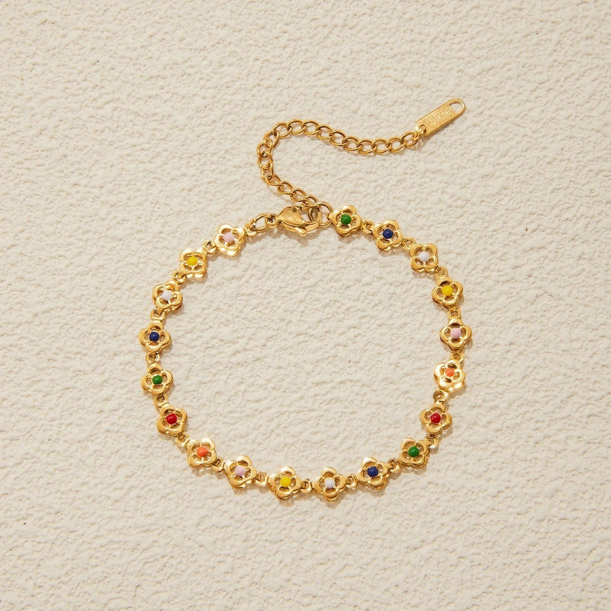 Pulsera Charm Dama con Varios Motivos Redondos y Acentos de Piedra Distribuidos