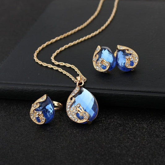 Pia – Conjunto Collar y Pendientes de Cristal Azul y Dorado