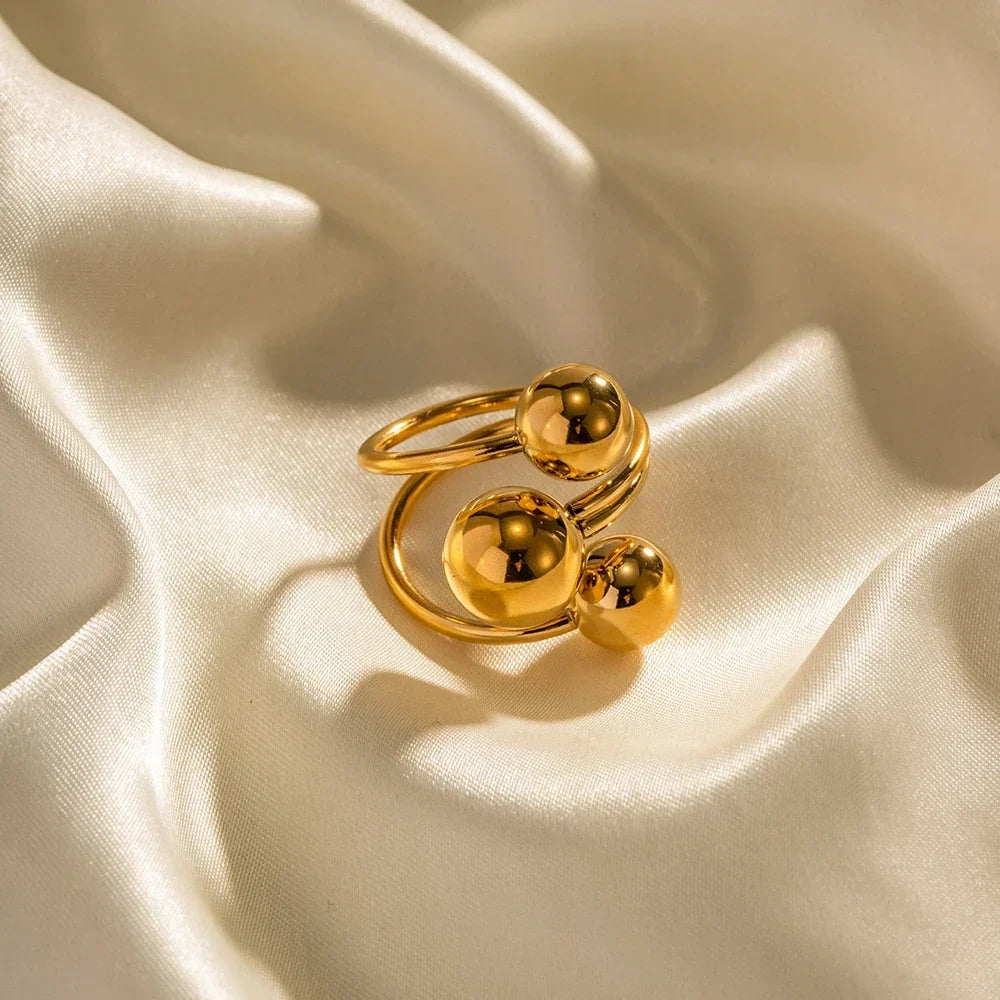 Anillo abierto ajustable para mujeres con diseño de tres esferas y estructura multibanda