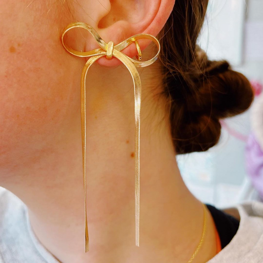 Pendientes de cinta con borlas largas