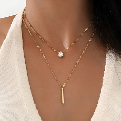 Virelle – Collar Superpuesto Dorado de Doble Fila con Colgante