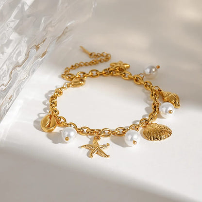 Maloi – Pulsera con Concha y Perla Dorada