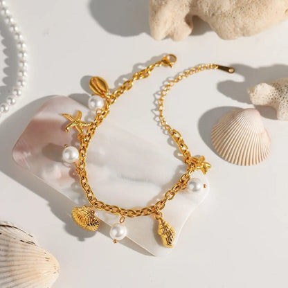 Maloi – Pulsera con Concha y Perla Dorada