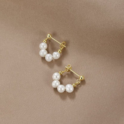 Yowe – Aretes de Perla de Brillo Dorado
