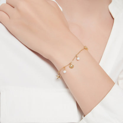 Pulsera con encanto de concha y estrella de mar