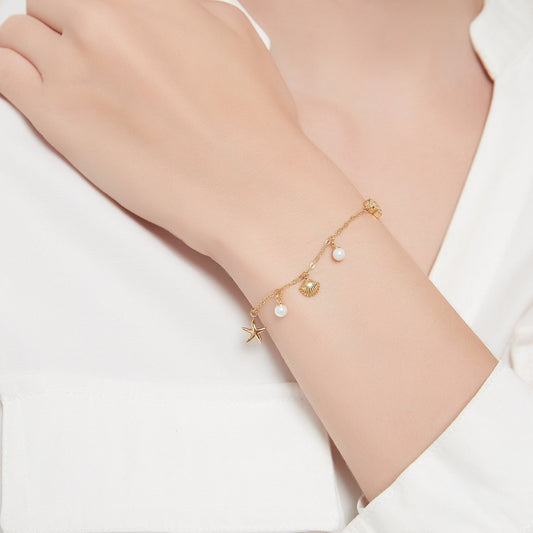 Pulsera con encanto de concha y estrella de mar