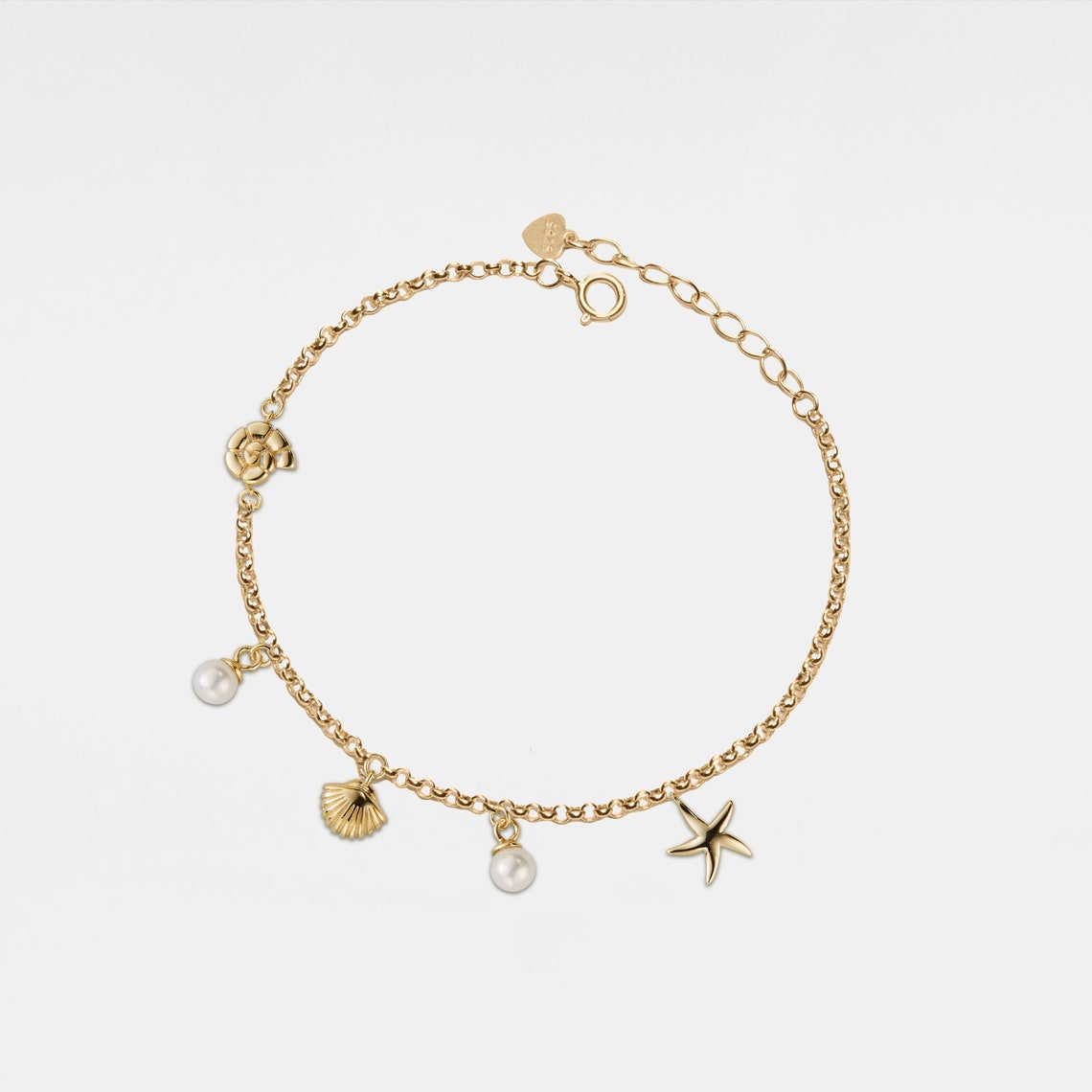 Pulsera con encanto de concha y estrella de mar