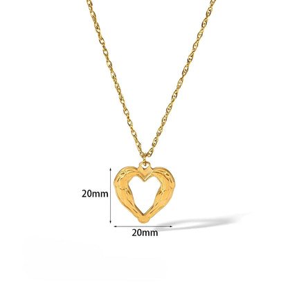 Tally – Collar Corazón Dorado en Acero Titanio