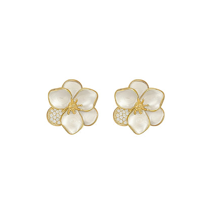 Dolly – Pendientes Dorados Flor con Piedra