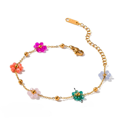 Roseline – Pulsera Dorada con Pequeñas Flores de Colores