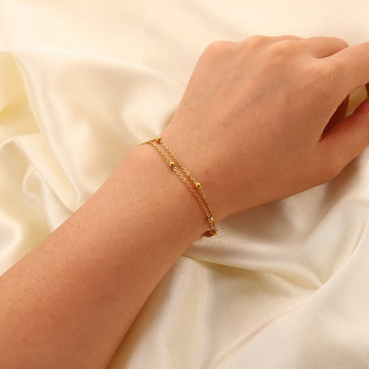 Erica – Pulsera Dorada Doble Cadena con Cuentas