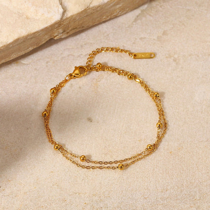 Erica – Pulsera Dorada Doble Cadena con Cuentas