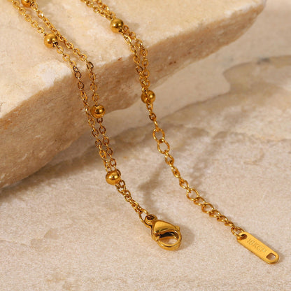 Erica – Pulsera Dorada Doble Cadena con Cuentas